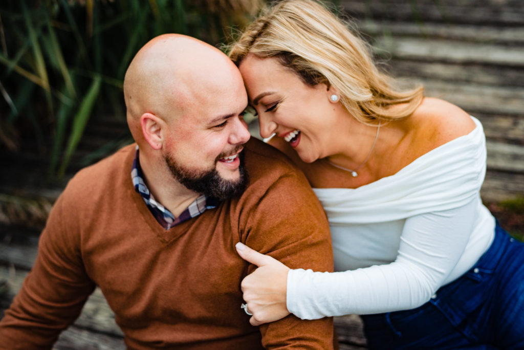Ashley snuggling Dan during their FDR Park Engagement Session
