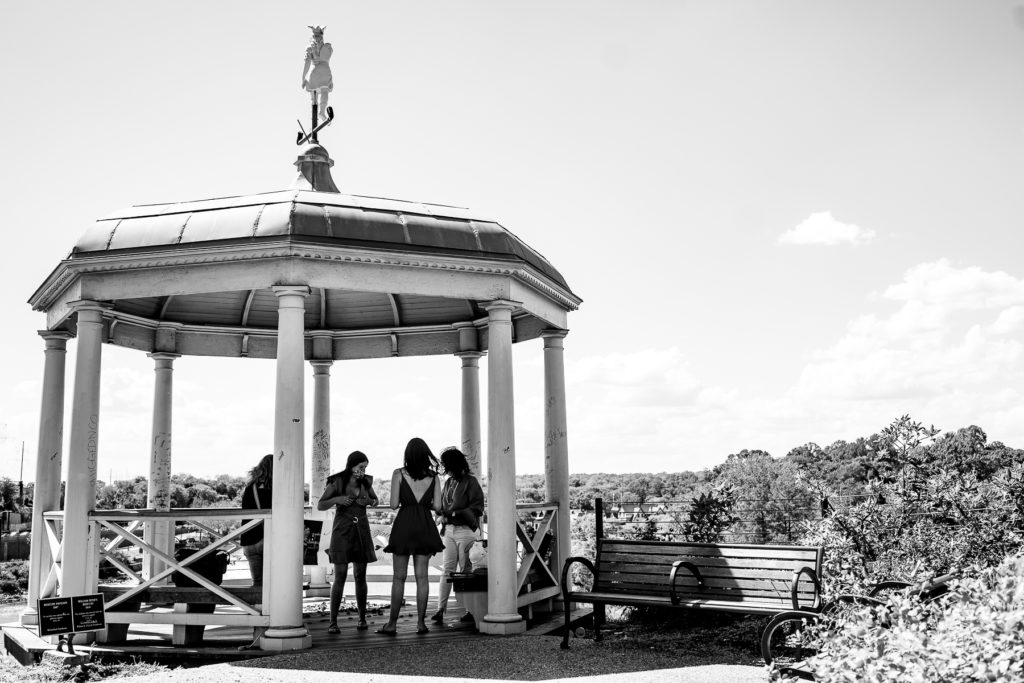 Family gathers and decorates a gazebo at the Philadelphia Museum of Art for a proposal.