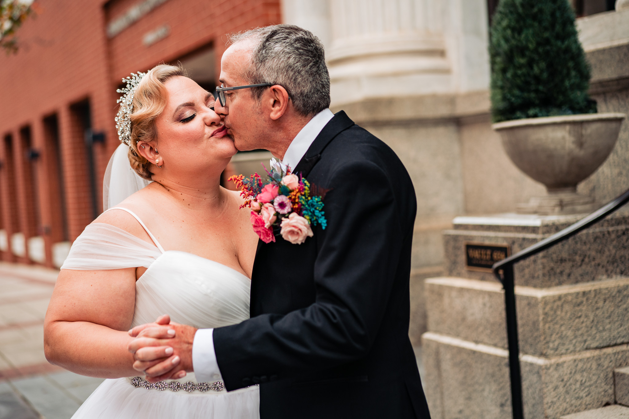 Wedding couple kisses in front of Vault 634