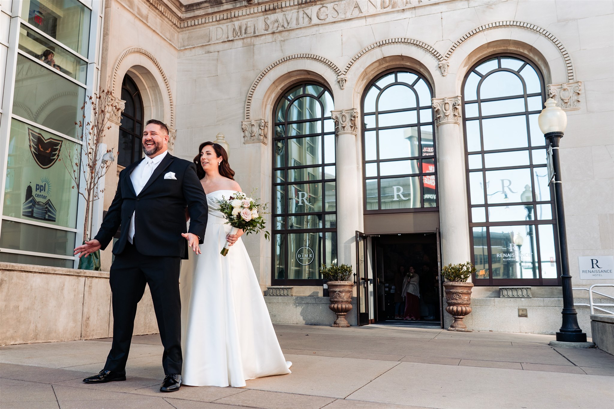 Photo of Bride walking to her groom in front of the Renaissance Allentown Hotel.